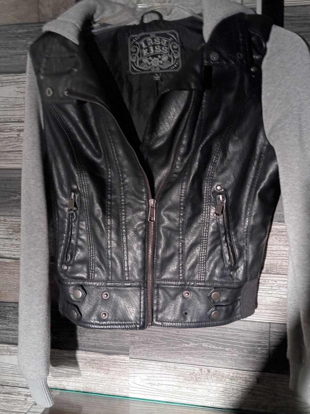 Last Kiss Black Faux Leather Moto Jacket with Gray Knit Sleeves